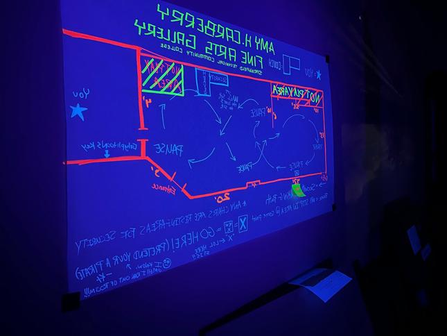 a map of the gallery glowing in a black light